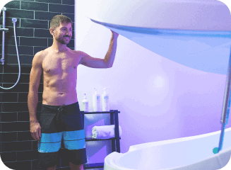 Floatation Tank therapy with man opening the lid