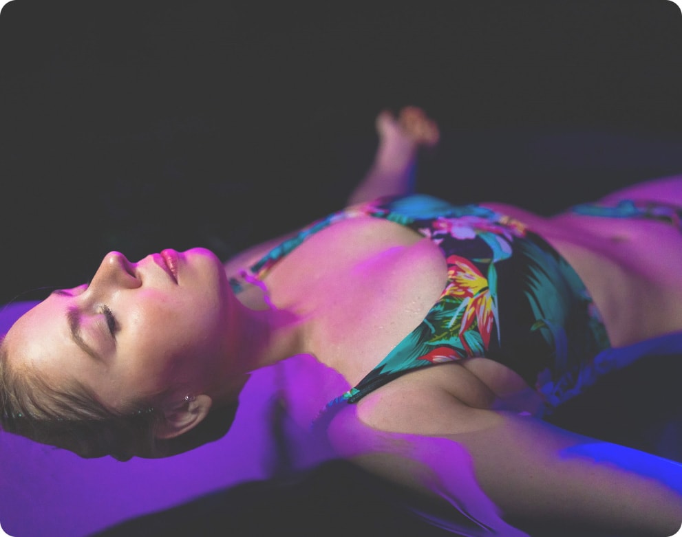 Floatation Therapy, Sydney with woman lying in colourful bikini