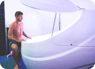 Floatation Tank therapy with man happy and ready to get in