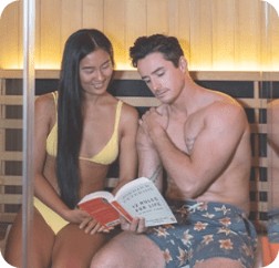 infrared sauna with man and woman reading novel